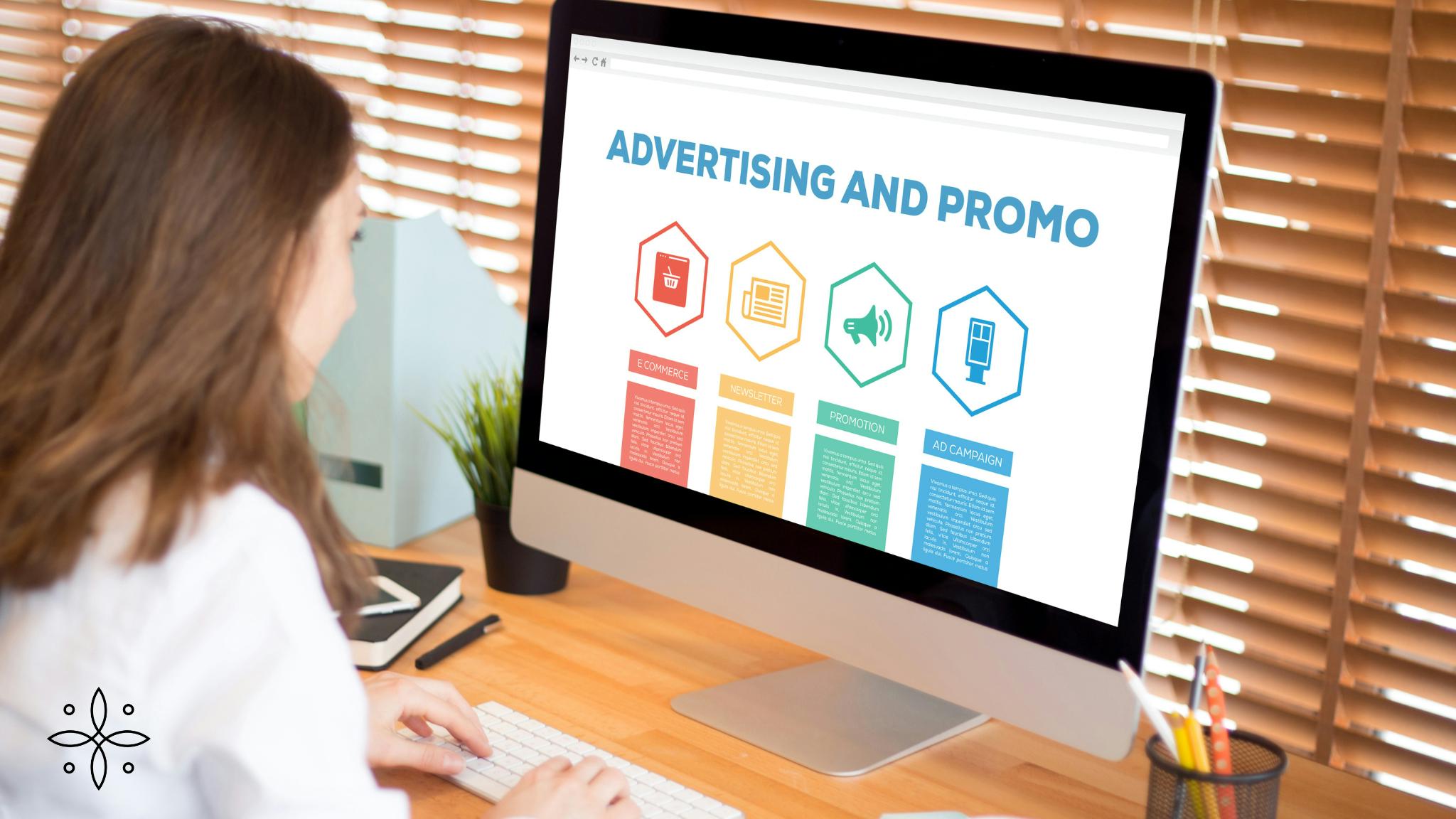 1 A woman uses a computer with a screen that displays "Advertising and Promo."